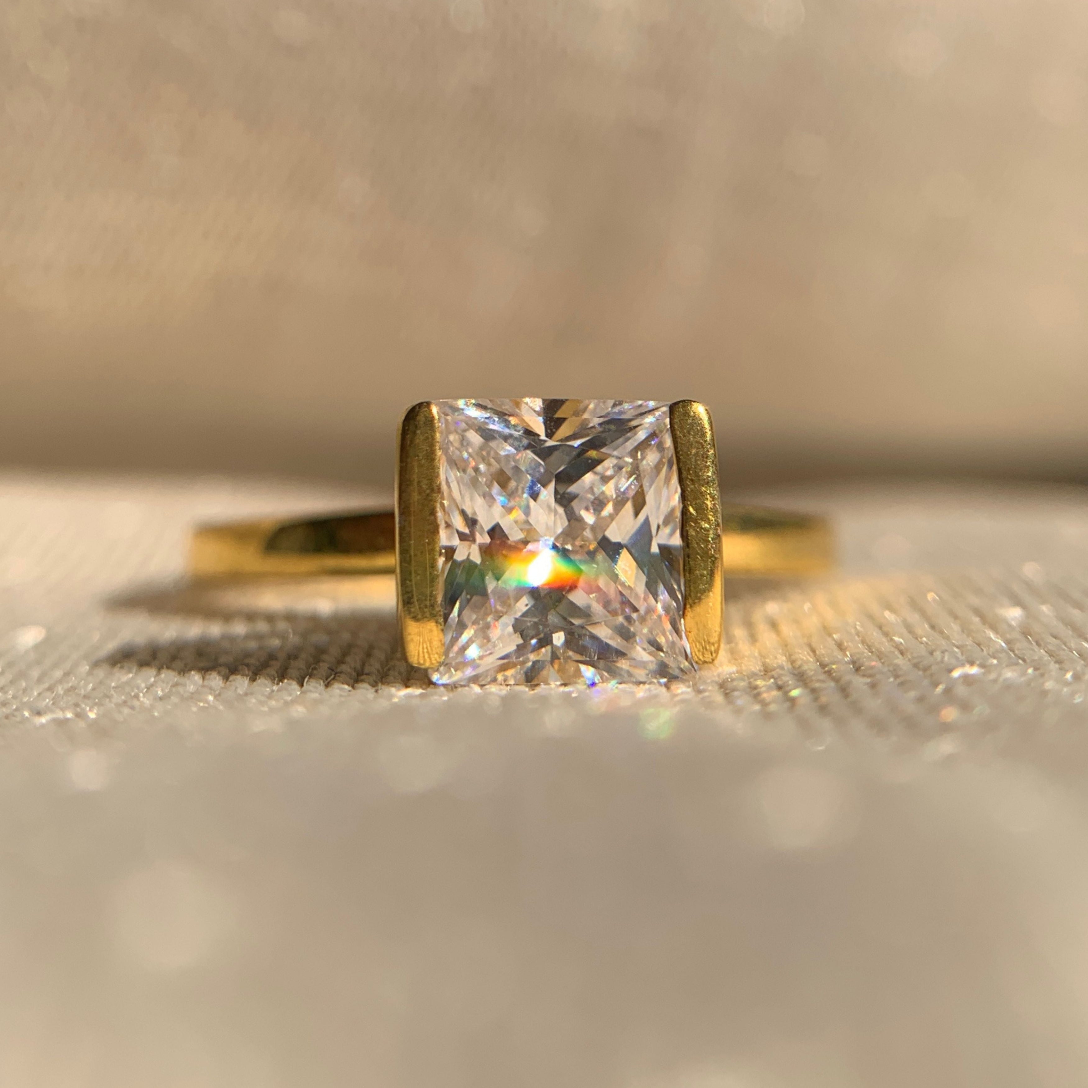 “1 carat princess cut solitaire engagement ring in classic white gold setting”